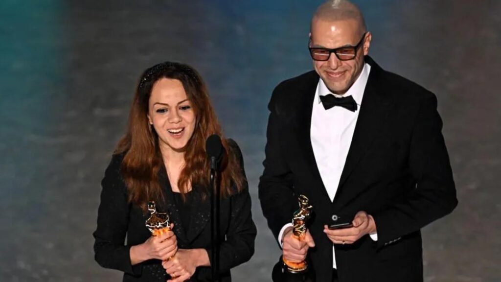 Oscars 2024: Top Moments: A Payback Kiss, Surprise Wins & Defying Gravity