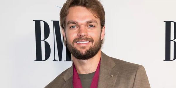 Country singer Conner Smith performing at a concert in 2024