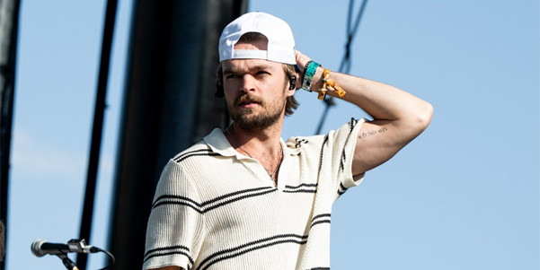 Country singer Conner Smith performing at a concert in 2024