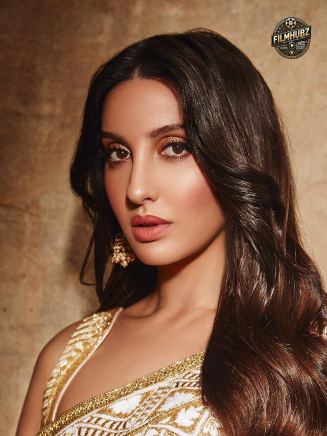 Nora Fatehi showcasing a luxury handbag