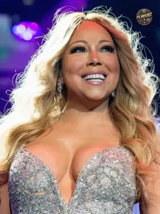 Mariah Carey performing in a gold minidress at the BET Awards 2025.