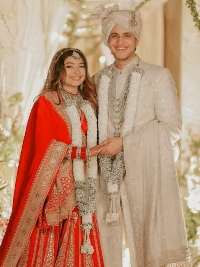 Nischay Malhan and Ruchika Rathore smiling together in traditional wedding attire.