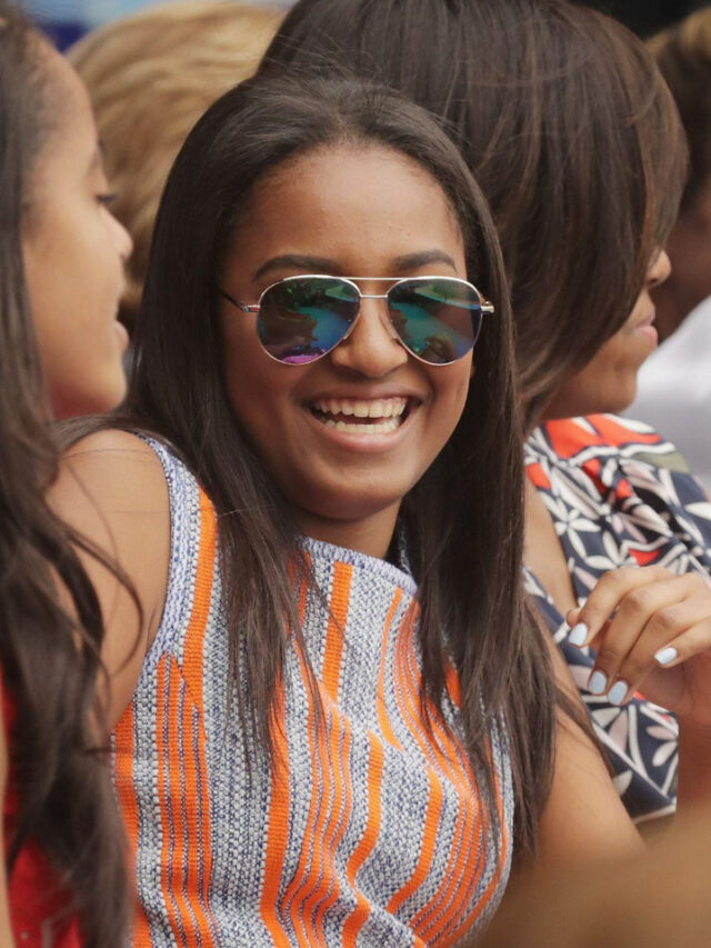 Michelle Obama and Sasha Obama smiling together in a rare family photo.